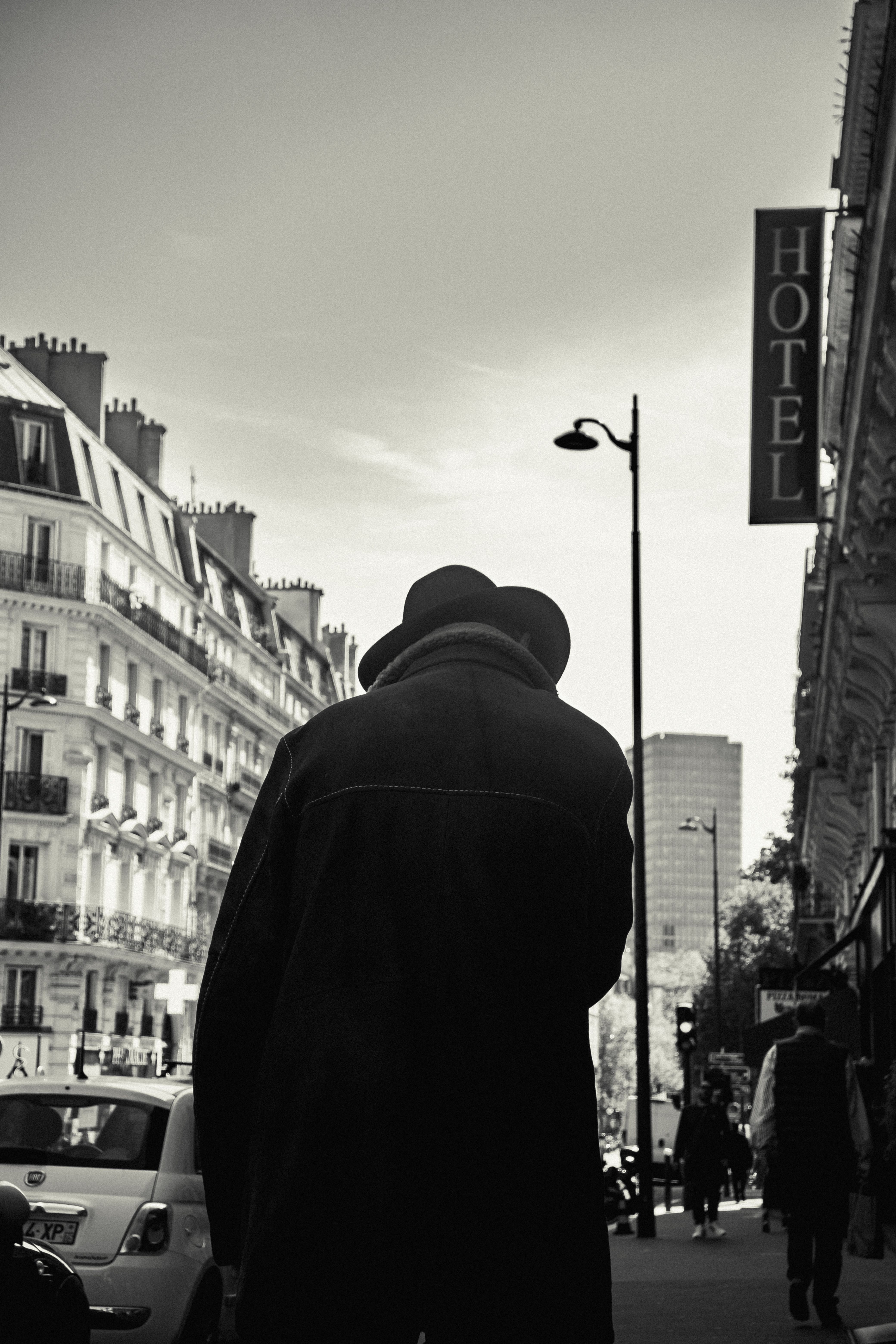Monochrome Photo of Man Wearing Trench Coat · Free Stock Photo