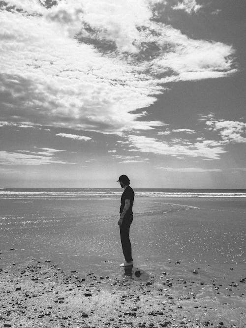 Man on Sea Shore in Black and White