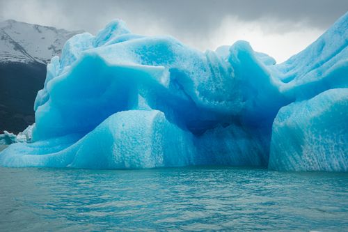 Free Stunning iceberg floating in icy waters showcasing nature's beauty and fragility. Stock Photo