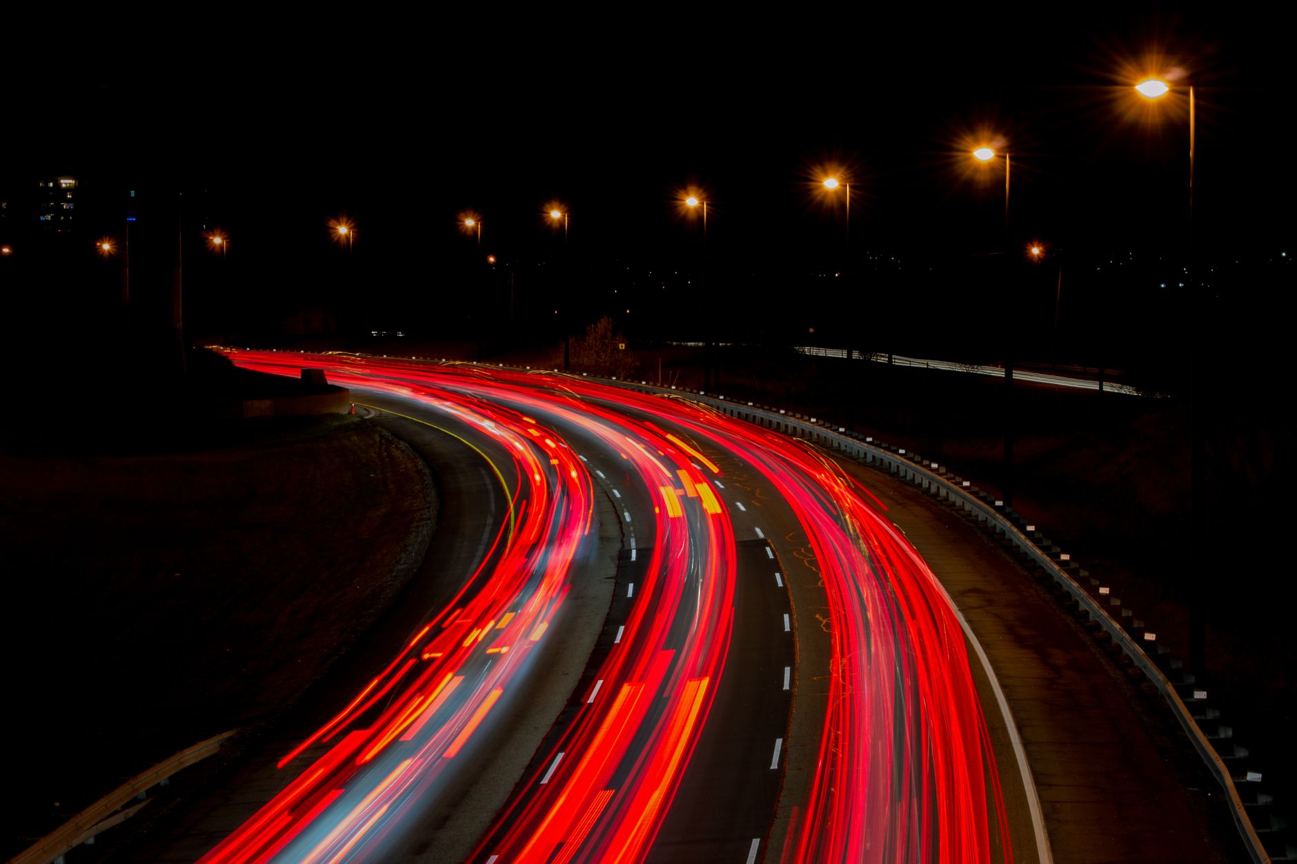 A captivating long exposure of a highway at night, showcasing vibrant light trails under streetlamps.. pexels, captivating, l