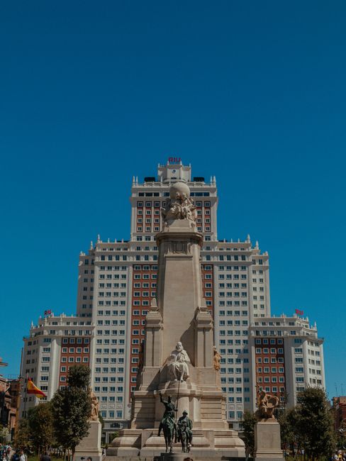 Iconic Edificio España building with a historic monument in Plaza de España, Madrid on a clear day.