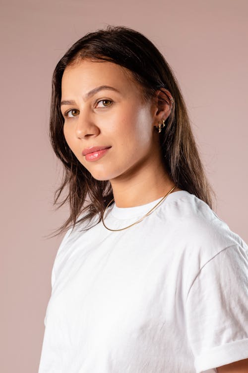 Studio Portrait of a Young Brunette in a White T-shirt 