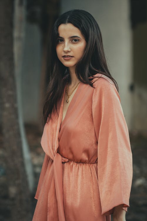 Young Brunette in a Pink Dress