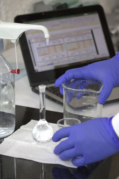 Lab technician mixing reagents