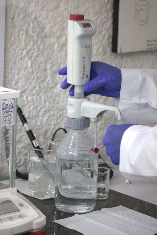 Laboratory Technician Dispensing a Reagent