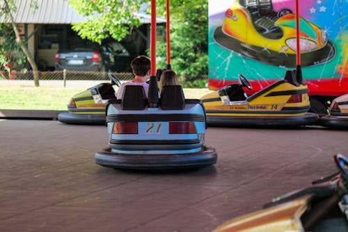 Children Driving Toys Cars in Amusement Park