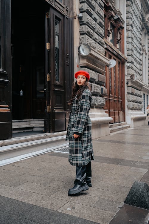 Woman in Coat Posing on Sidewalk