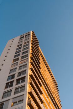 Stunning view of a high-rise building in Mazatlán, México during sunset, showcasing urban architecture.