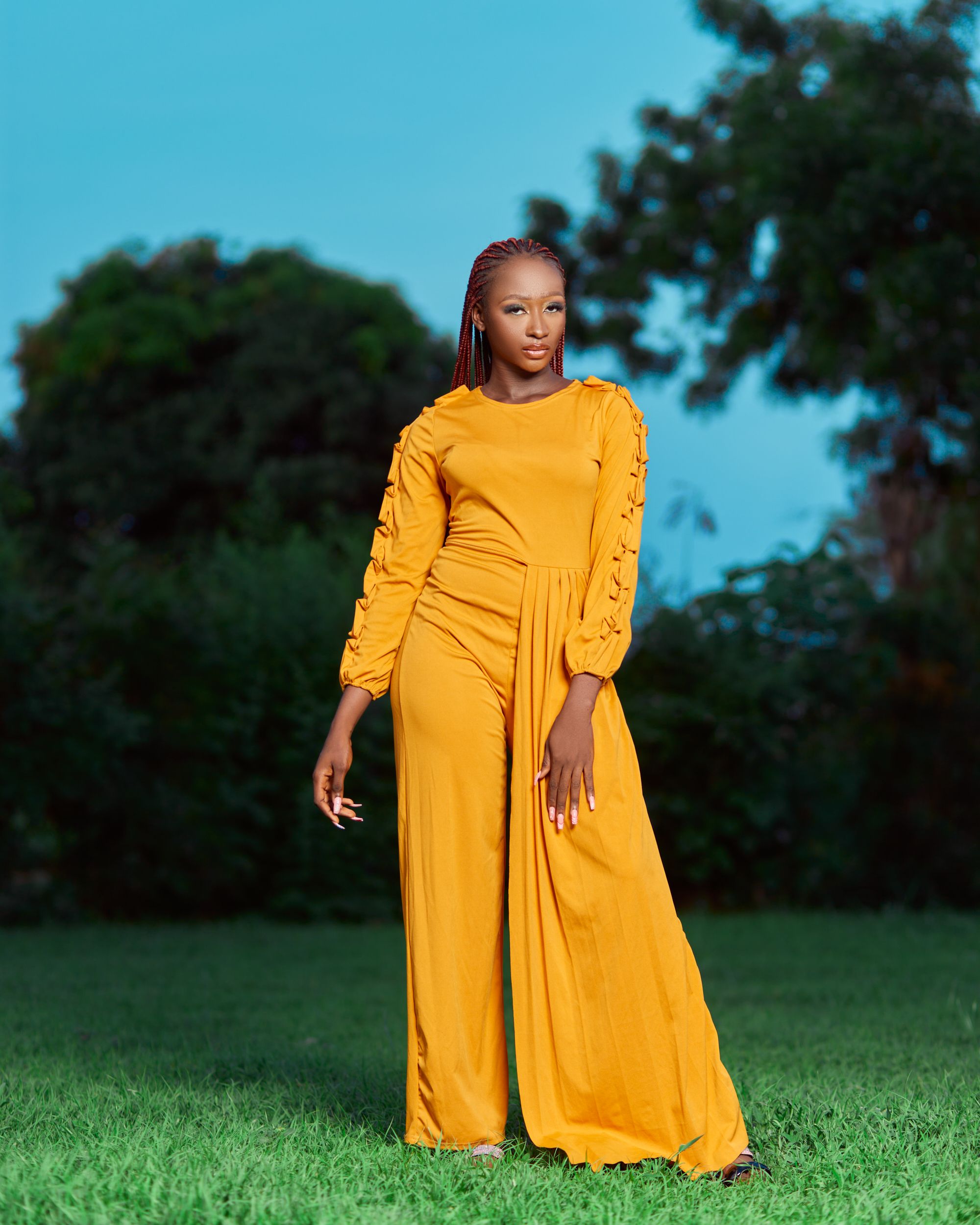Young Woman in a Yellow Dress Posing Outdoors · Free Stock Photo