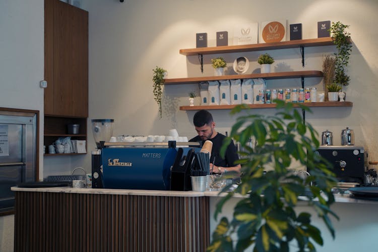 Man Working At Cafe