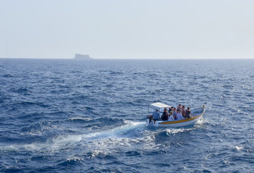 People on Motorboat on Sea