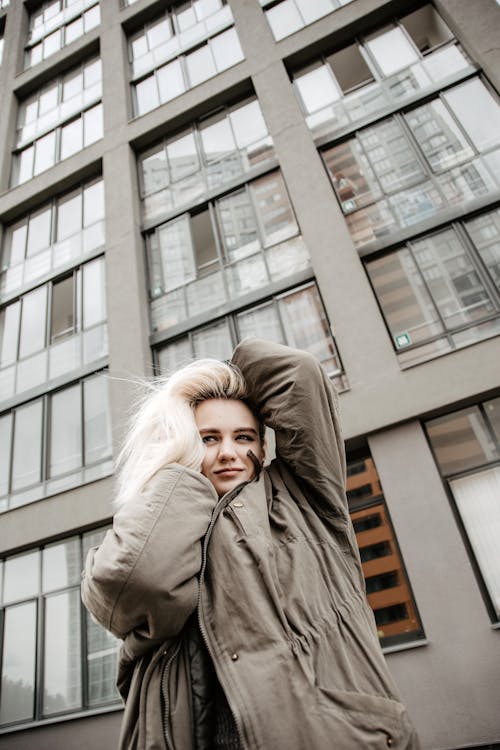 Free Woman Posing in Front of Building Stock Photo