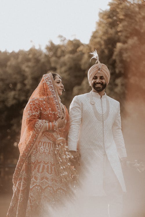 Smiling Newlyweds in Traditional Clothing