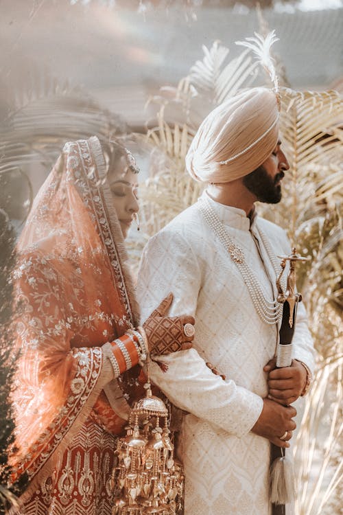 Newlyweds Standing in Traditional Clothing