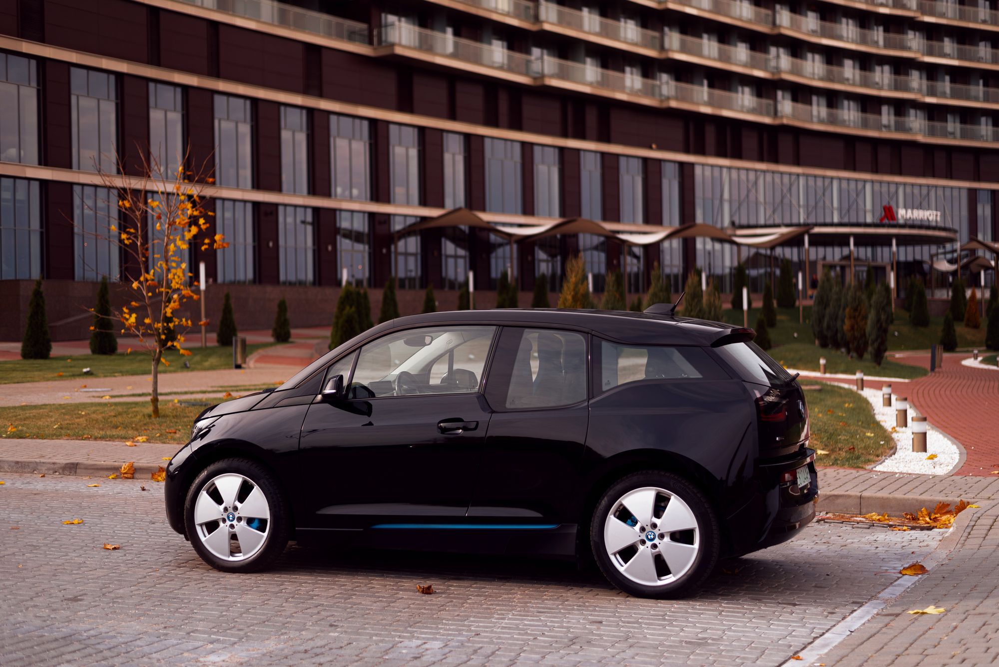 A BMW EV (i3) parked outdoors is the most relevant editorial image for a BMW electric vehicle sales article.