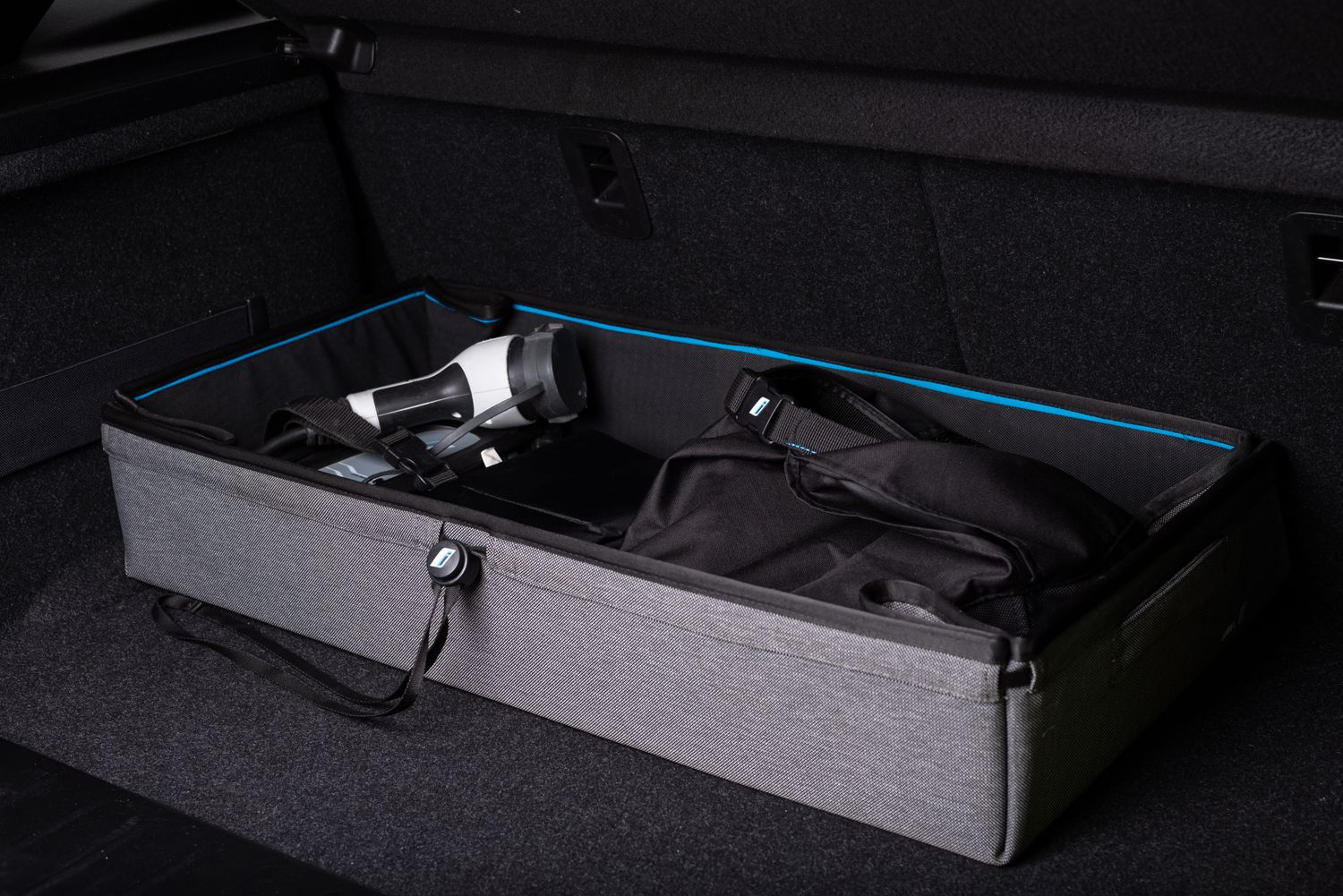 Organized car trunk with automotive travel and storage items