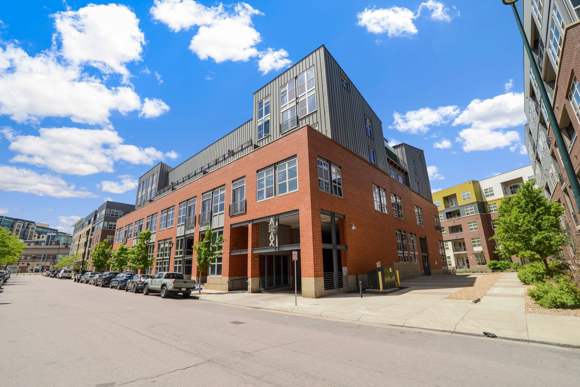 Contemporary urban building exterior with clear blue sky in Denver.
