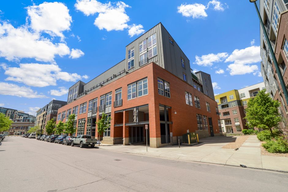 Contemporary urban building exterior with clear blue sky in Denver.