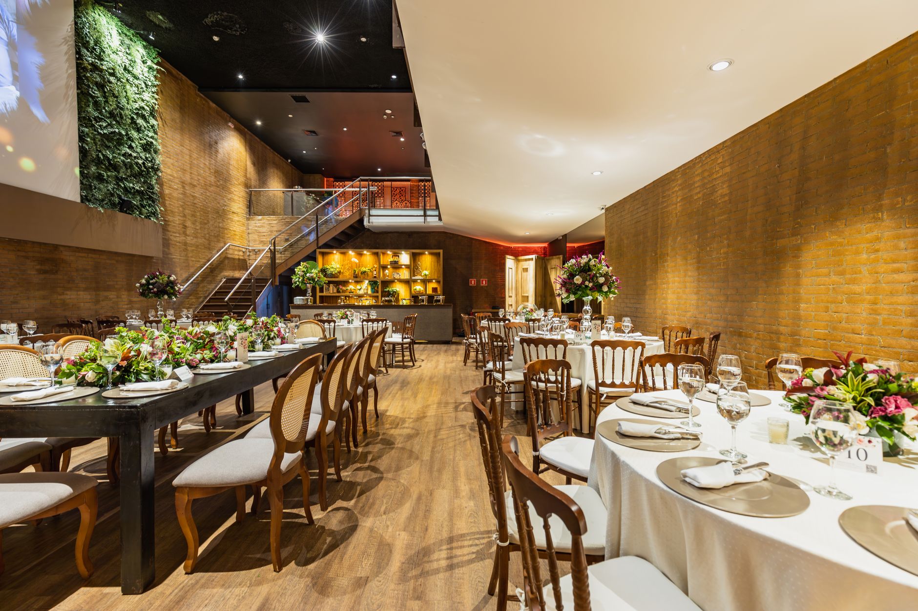 Beautifully decorated wedding venue with tables set for an elegant celebration.