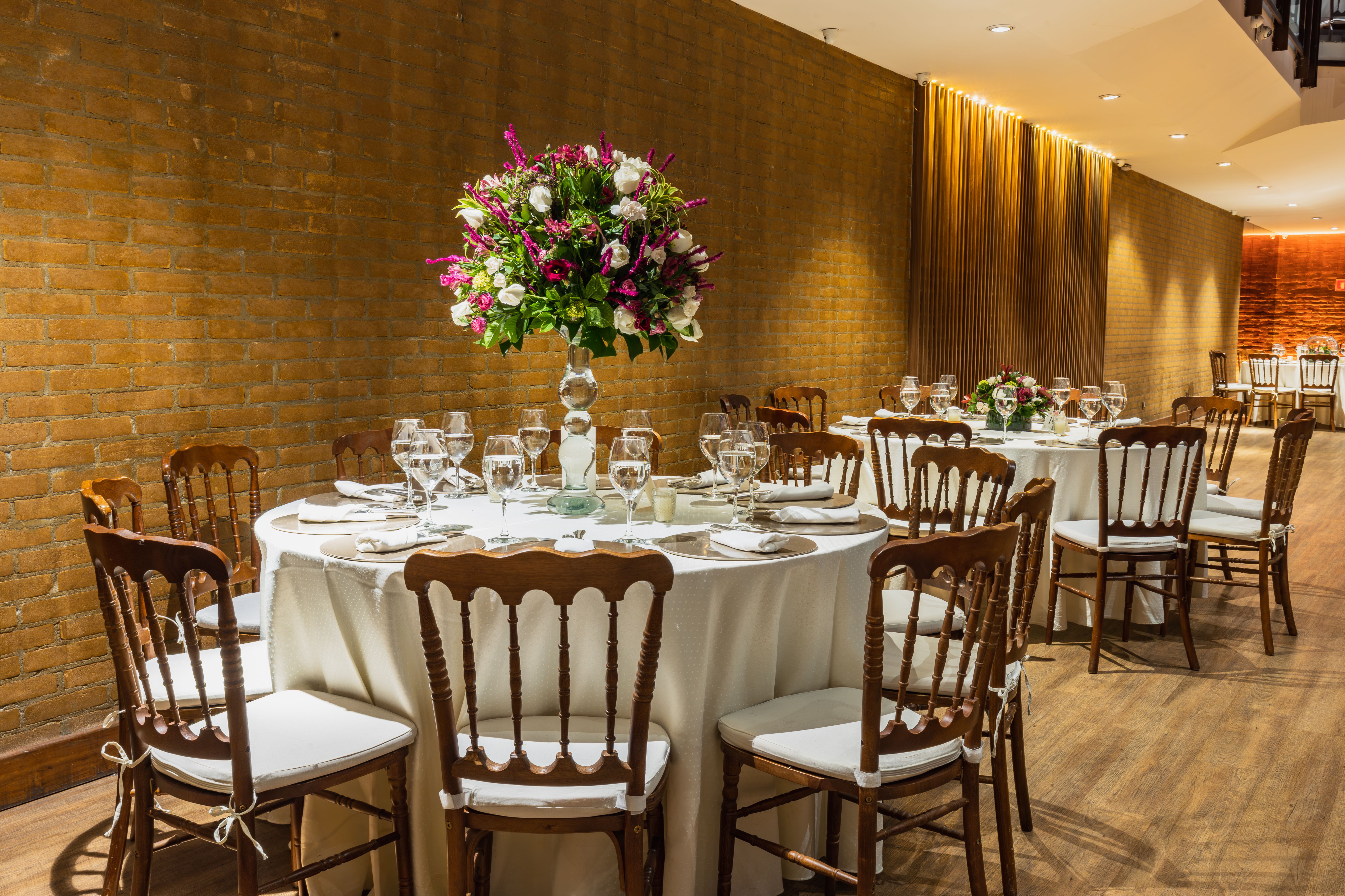 Sophisticated wedding table setup with floral centerpiece and elegant dining elements.
