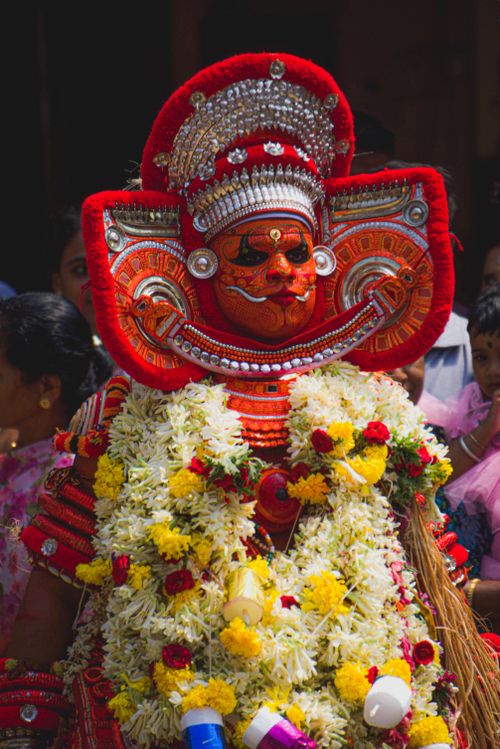 Free Vibrant traditional theyyam performer in ceremonial costume during ritual worship. Stock Photo