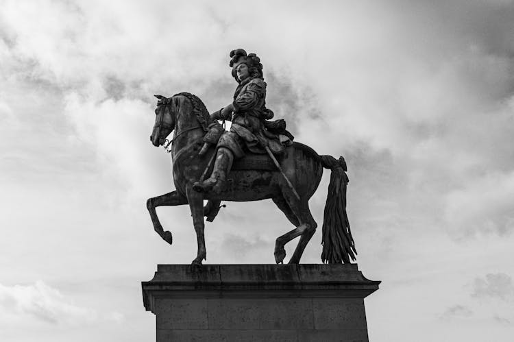 Low Angle Shot The Equestrian Statue Of Louis XIV In Versailles, France 