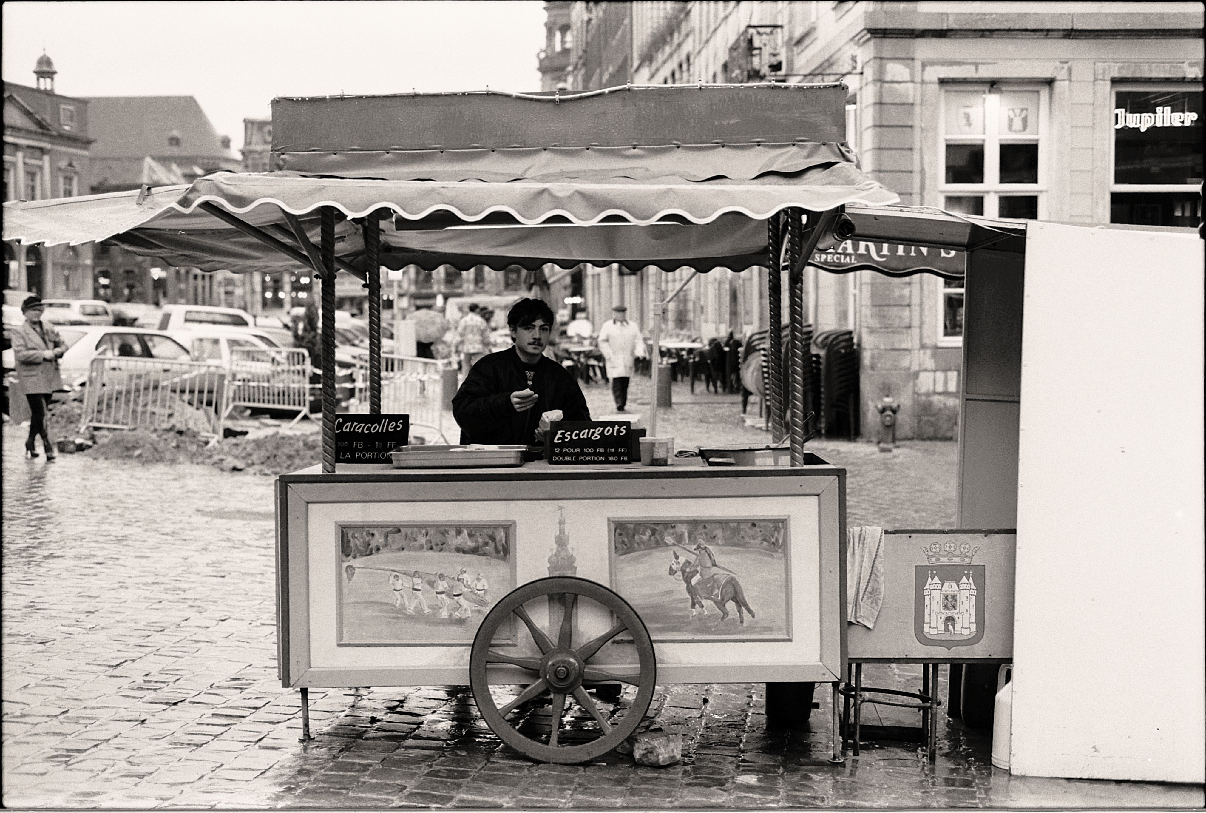 A cone of authentic Belgian frites with mayonnaise from a street vendor in Belgium