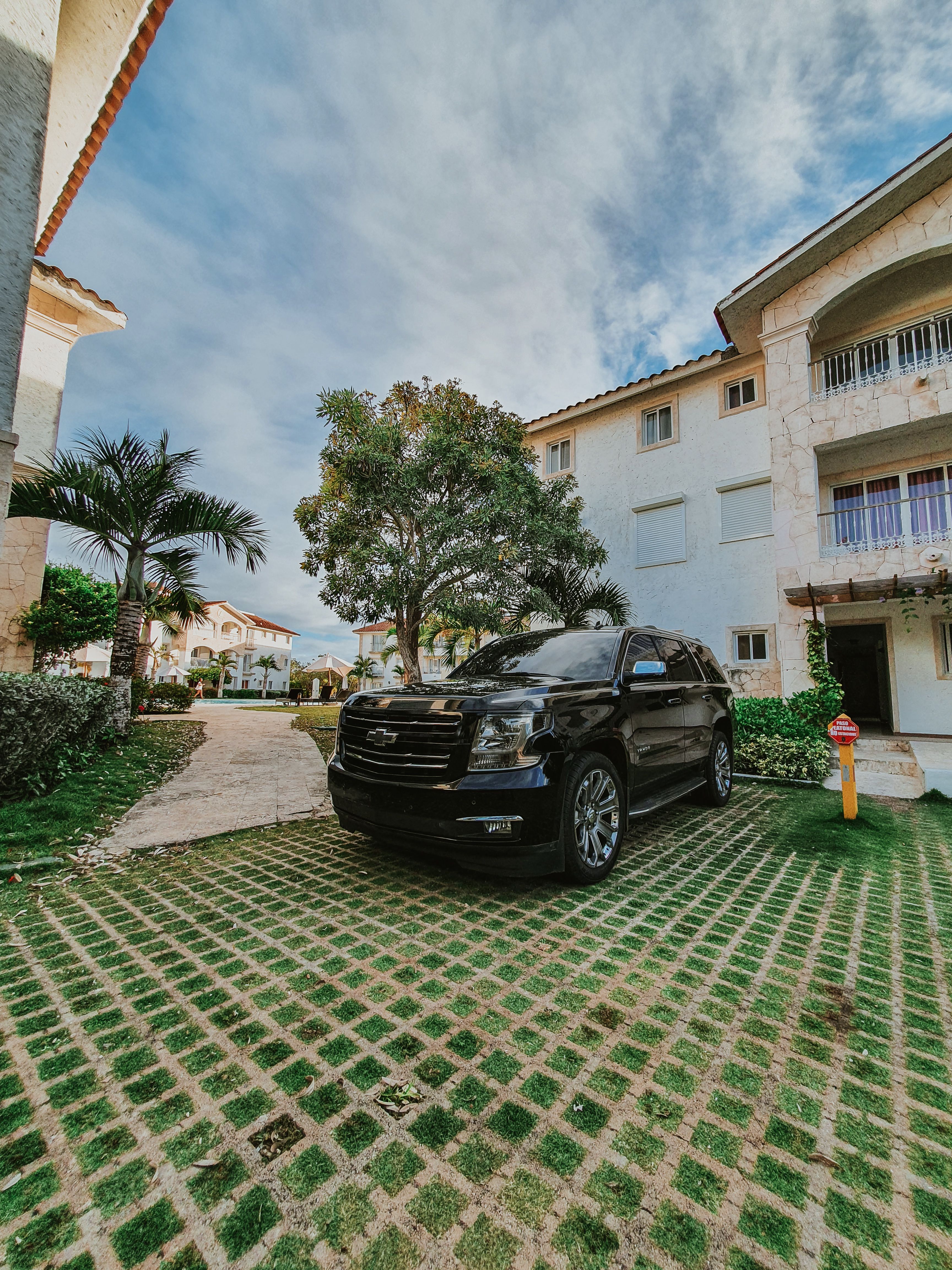 SUV Car Parked in Front of a House · Free Stock Photo