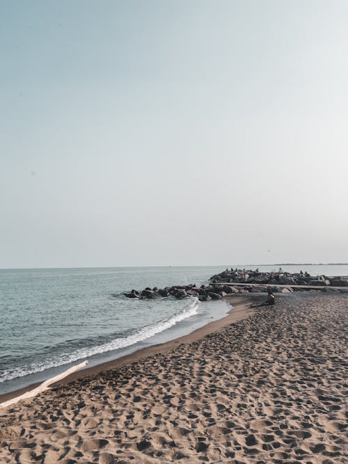 View of an Empty Beach and Seascape under Clear, Blue Sky 