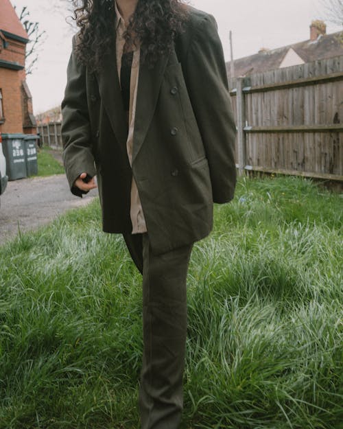 Woman Walking in Green Coat