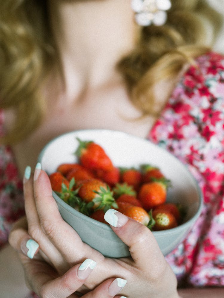 Woman Holding Bowl Of Strawberries