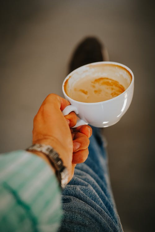 Hand Holding Coffee Cup