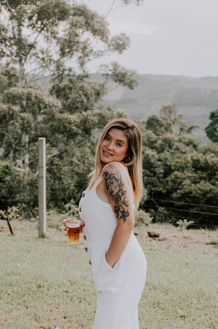 Woman Wearing White Dress On A Field