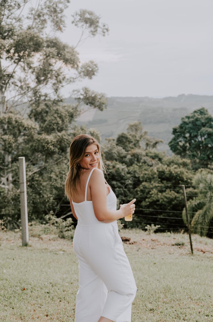 Woman Wearing White Dress On A Field