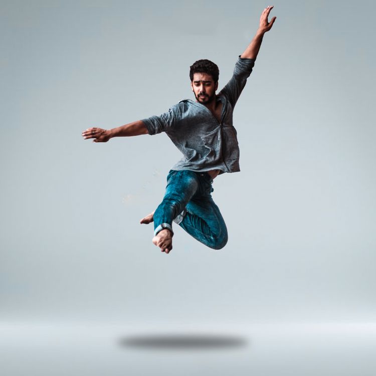 Man Jumping While Raising His Both Arms · Free Stock Photo
