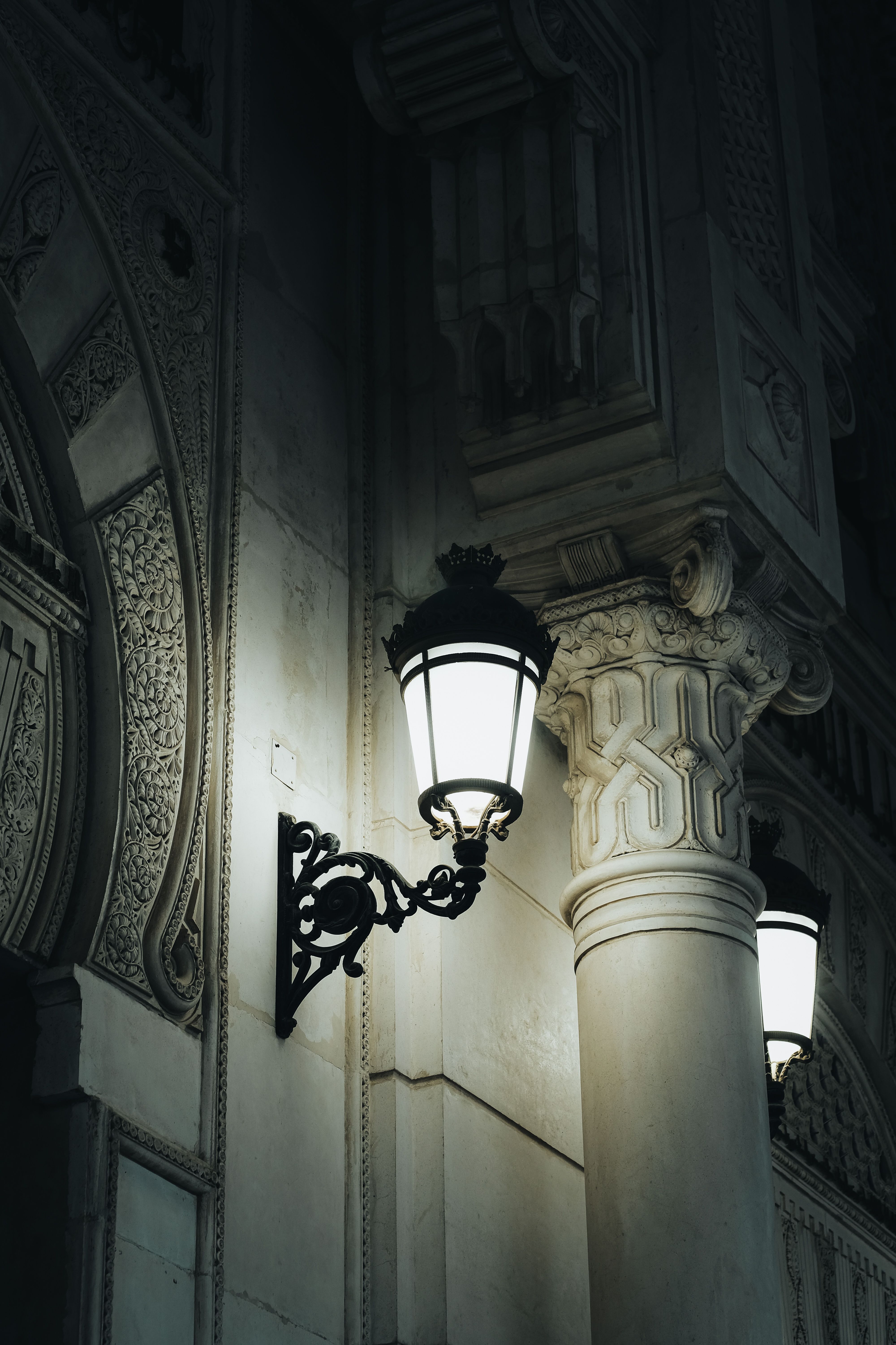 Wall Light Illuminating Column and Building Exterior · Free Stock Photo