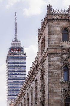 Contrasting historic and modern architecture in Mexico City featuring Torre Latinoamericana.