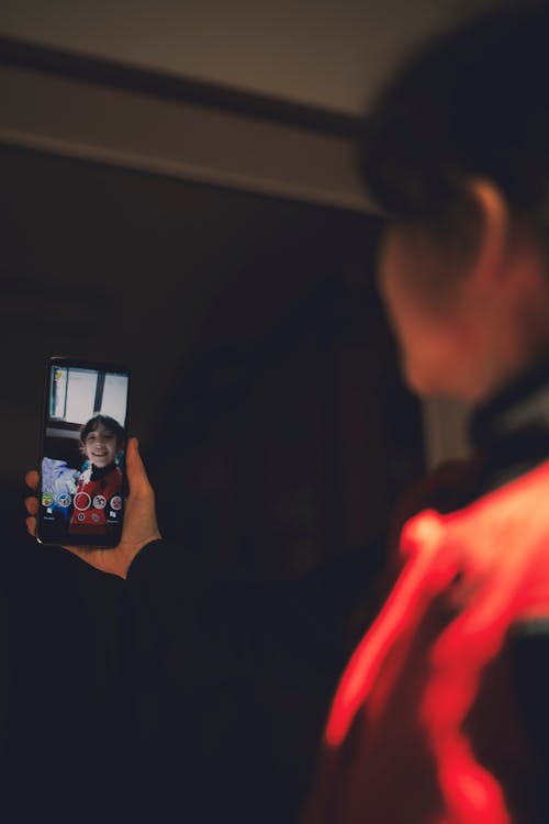 Girl Holding Black Android Smartphone