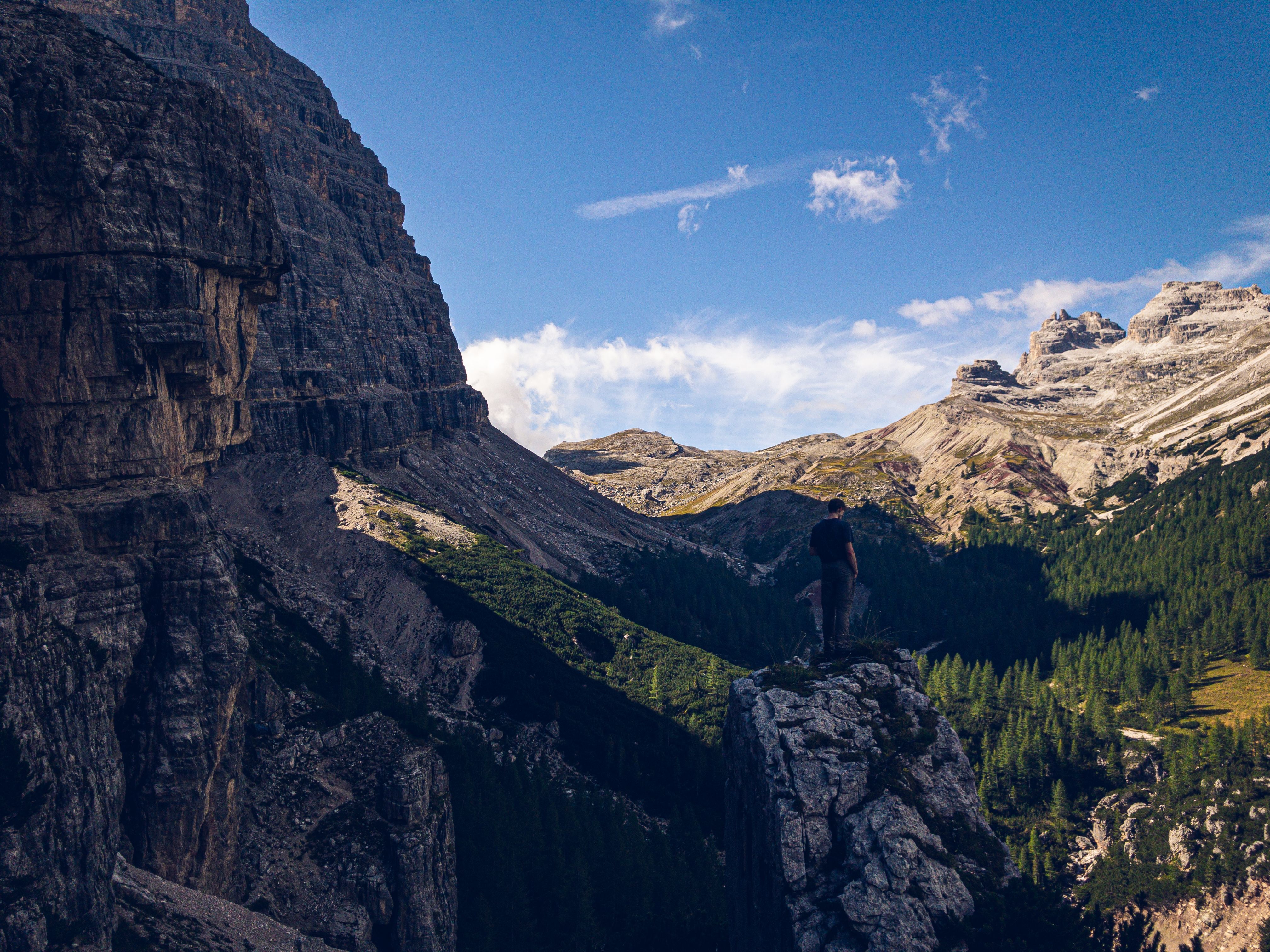 Hikers enjoying a scenic trail in the Italian Dolomites, highlighting adventure sports coverage