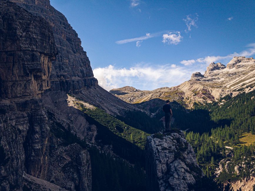 Hikers enjoying a scenic trail in the Italian Dolomites, highlighting adventure sports coverage