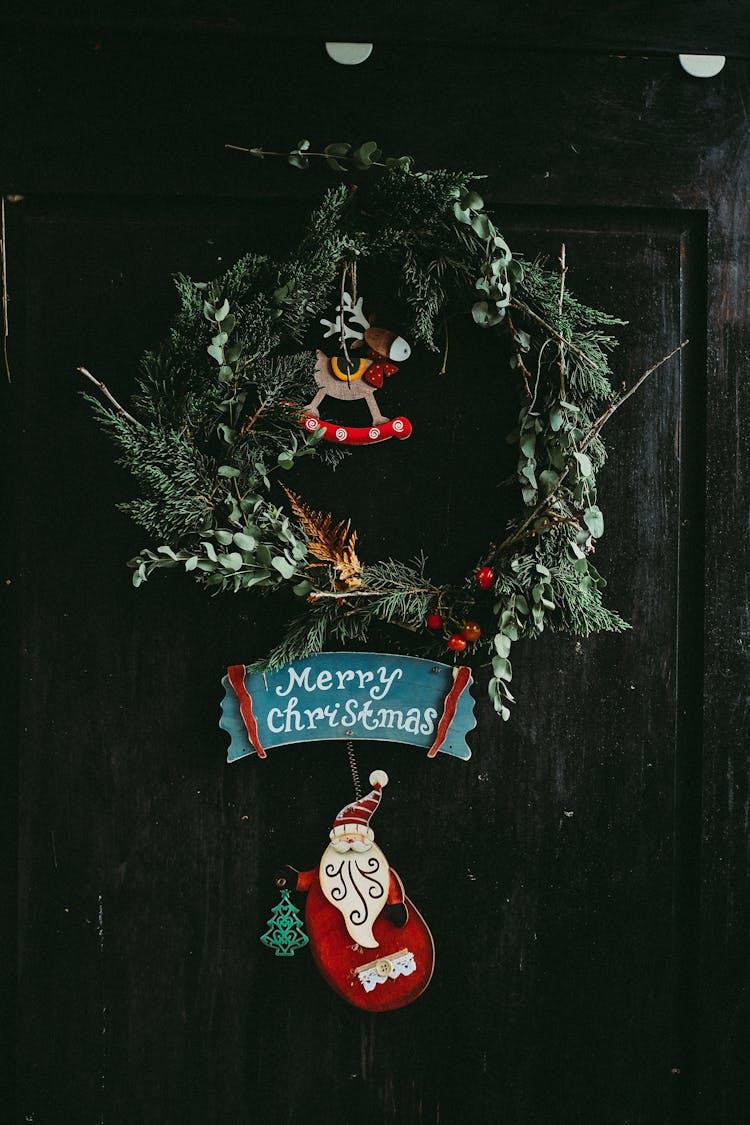 Green Christmas Wreath Hanging On Door