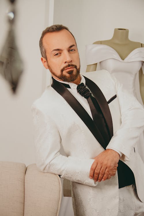 Man Posing in White Suit