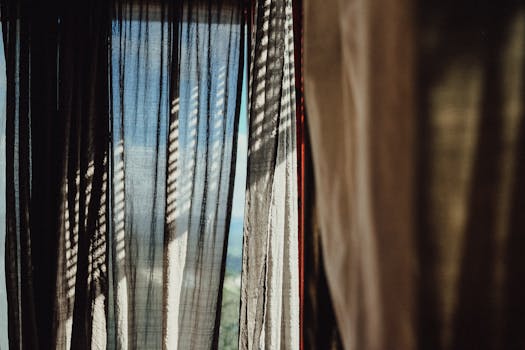 Focus Photography of Brown Curtain