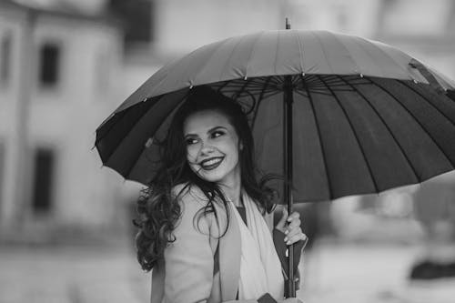 Smiling Woman with Umbrella in Black and White