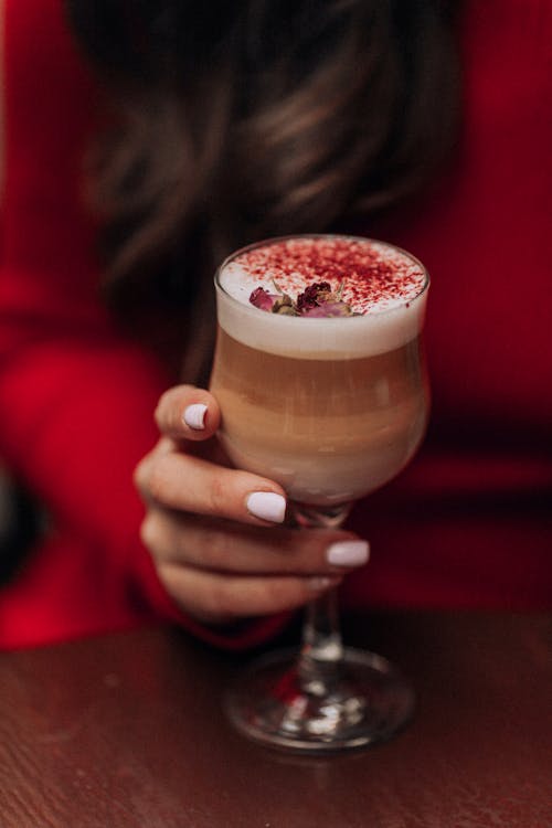 Woman Hand Holding Cappuccino Glass
