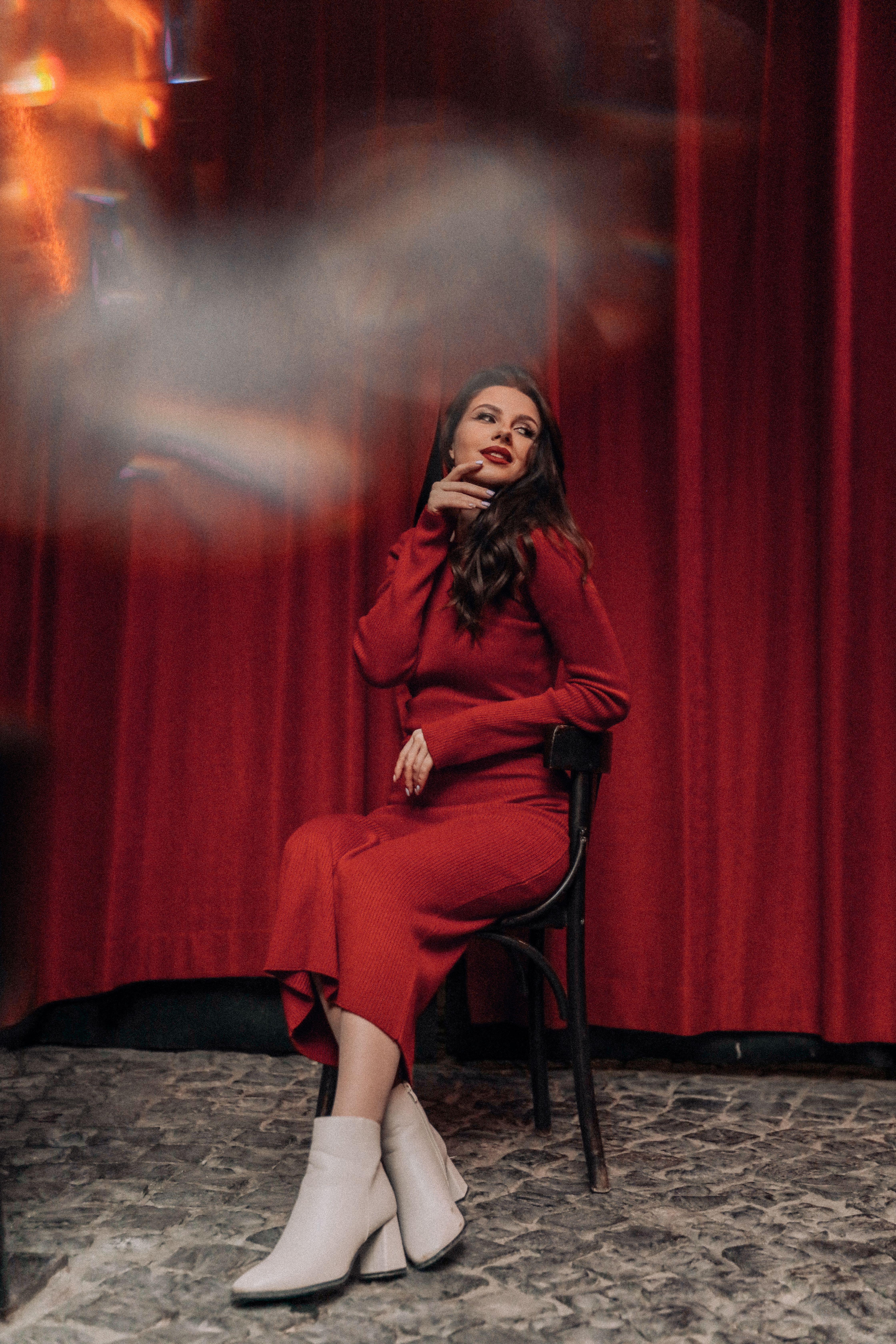 Young Woman in a Red Dress Sitting on a Chair · Free Stock Photo