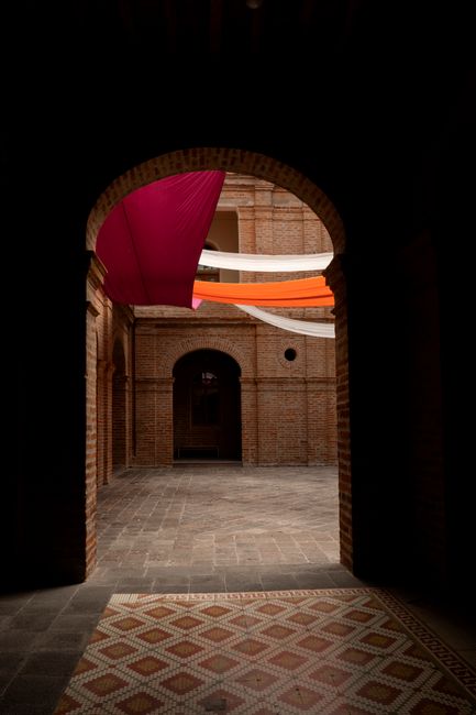 Explore the vibrant interplay of color and structure in a courtyard in Quito, Ecuador.