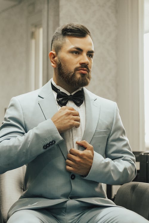 Sitting Man in Tuxedo and Bow Tie 