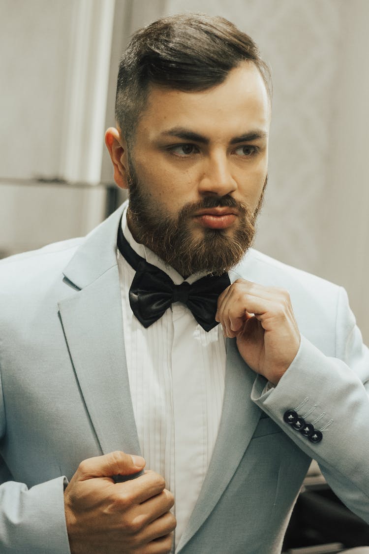 Man Adjusting Bow Tie