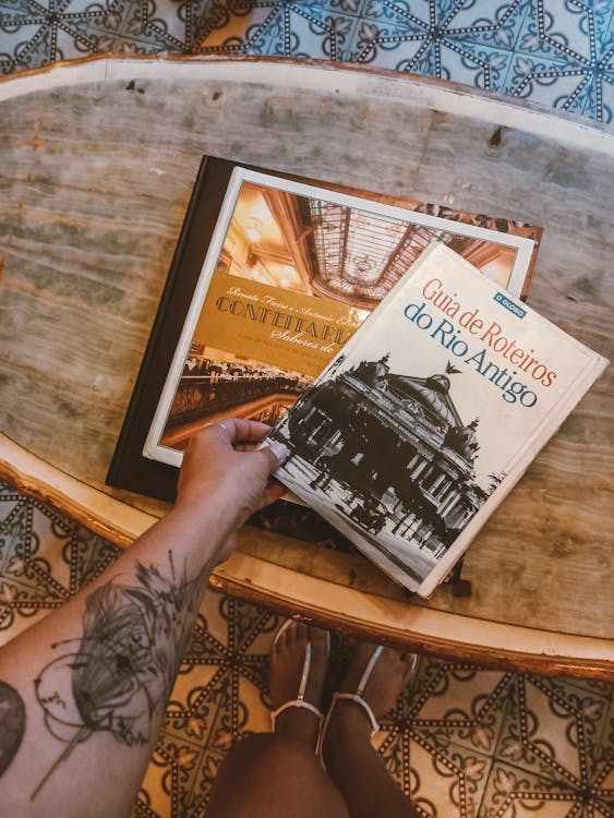 Womans Hand Holding a Book 